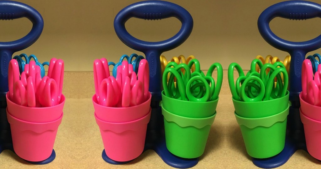 Colorful scissor caddy for kids with kids sized scissors on table top