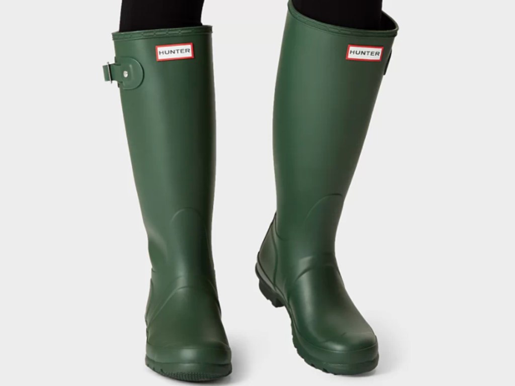 womens wearing tall green hunter rain boots