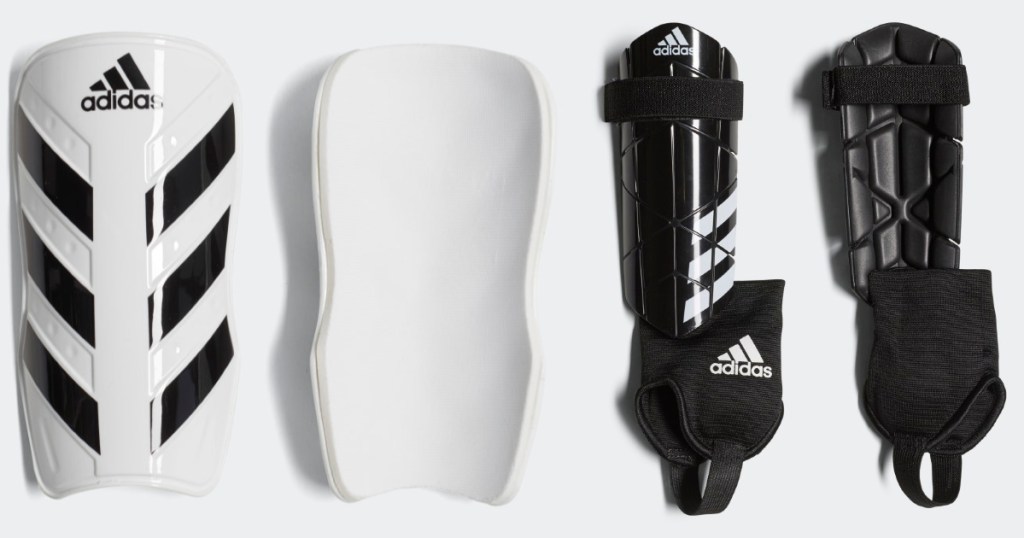 white and black adidas shin guards