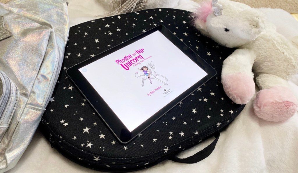 amazon freetime reading on ipad on bed next to unicorn