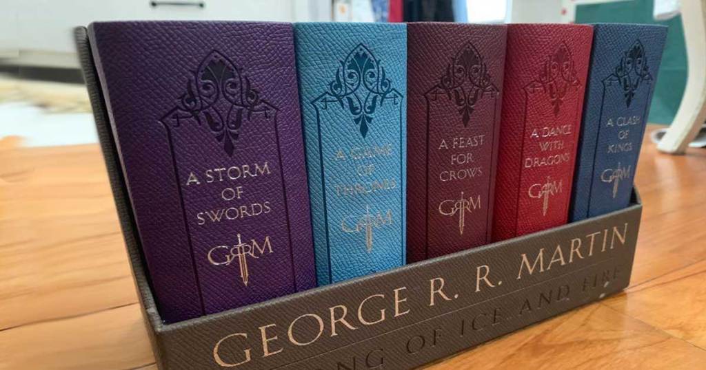 set of five leather books game of thrones on a table