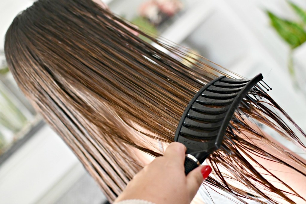 brushing wet hair with detangling brush