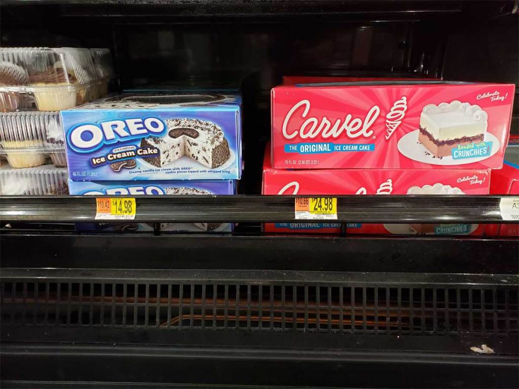 ice cream cakes on a shelf in a store