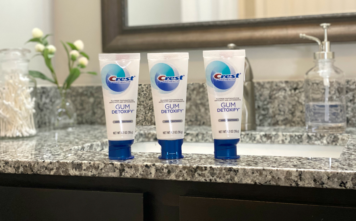 three tubes of crest toothpaste