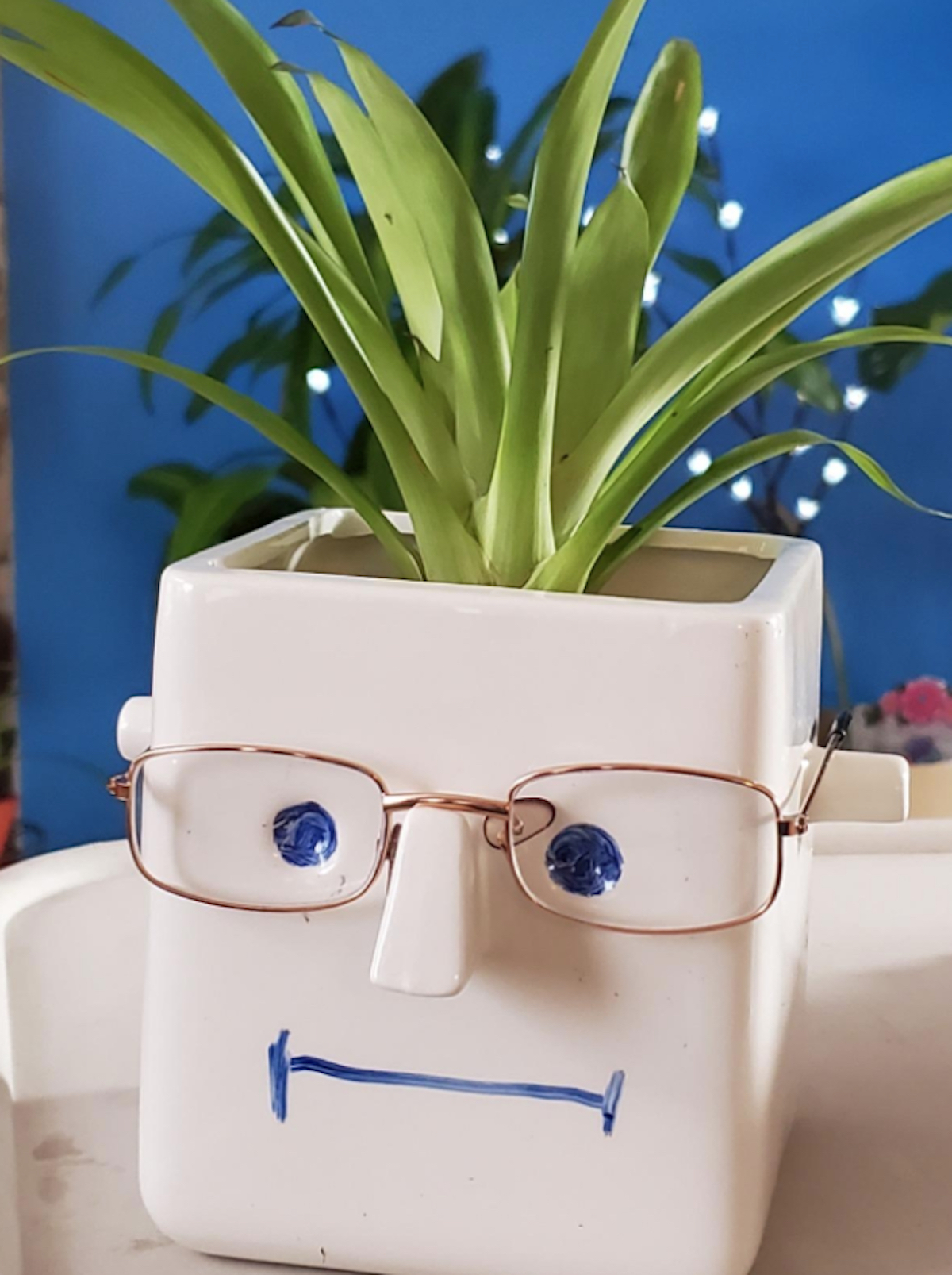 white planer box with face and glasses on it