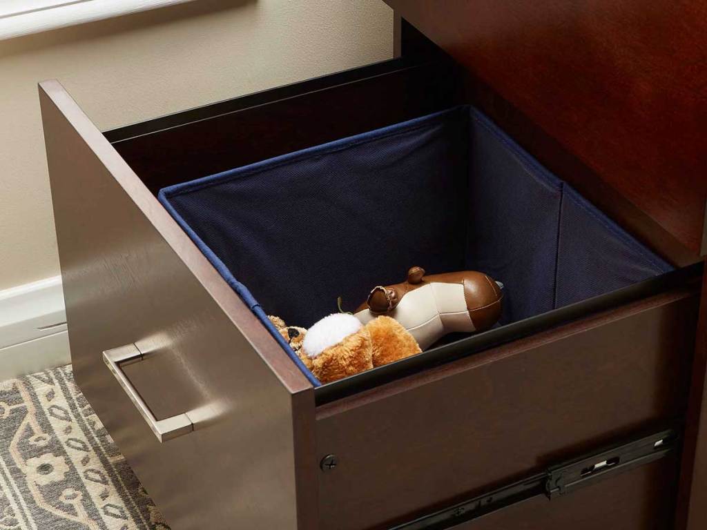bin inside a drawer with toys