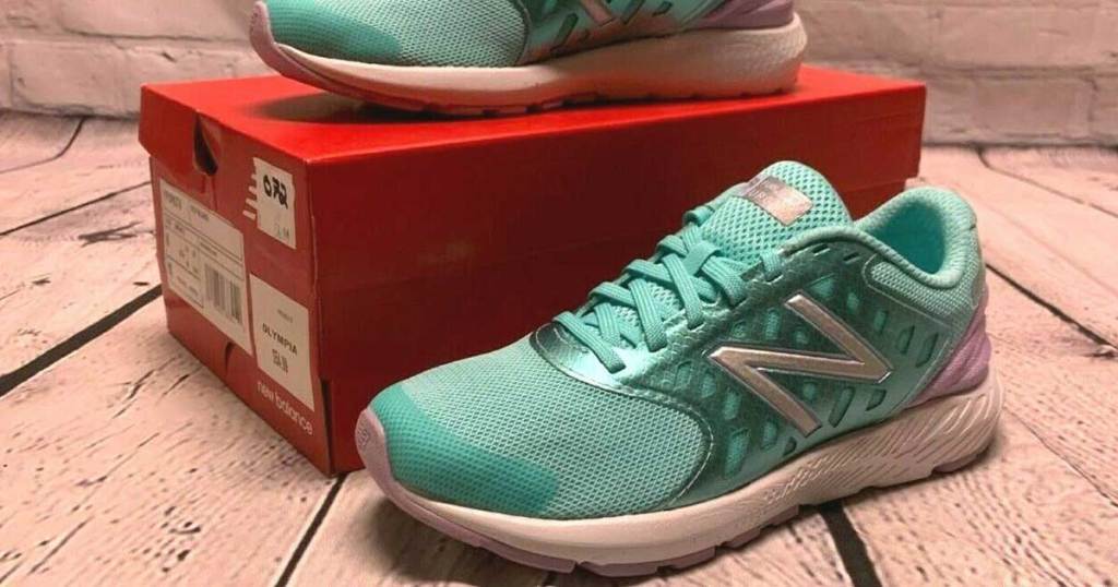 new balance running shoes propped on a shoe box