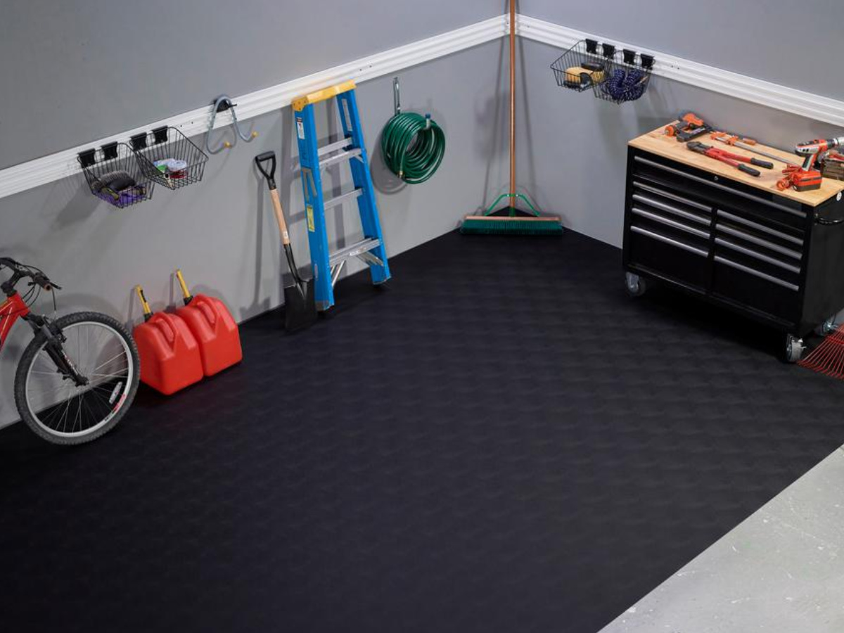 black flooring in garage with tools 