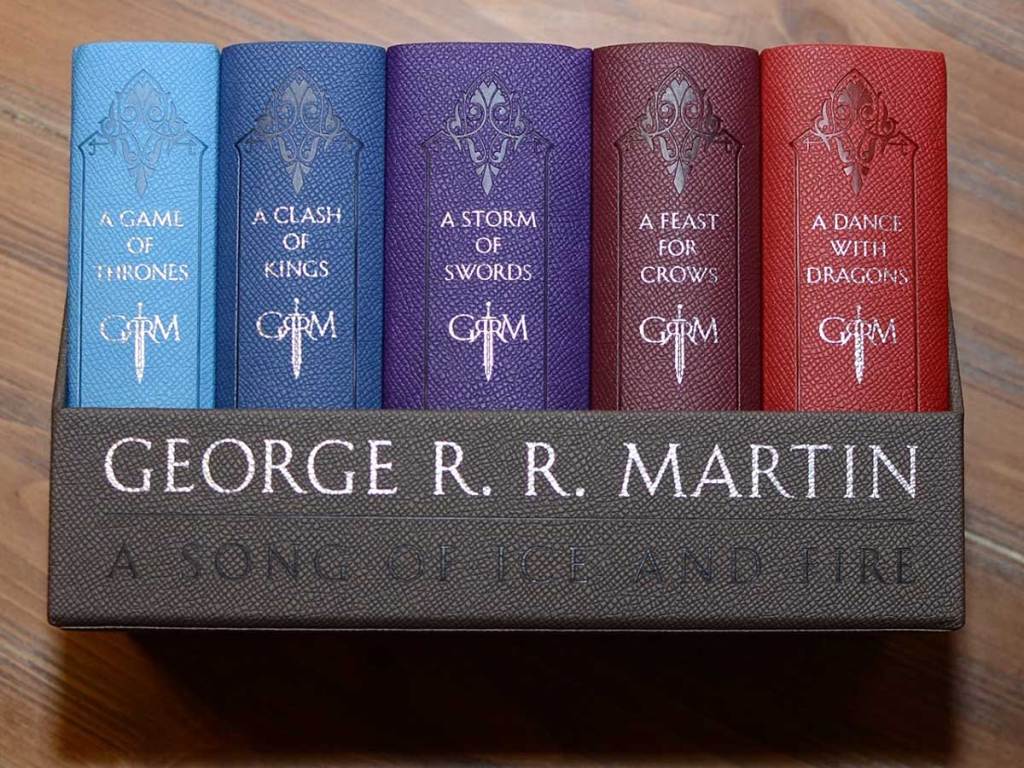game of throne 5 book leather set on a table