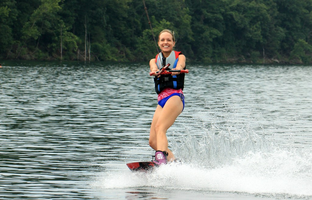 woman wakeboarding in lake