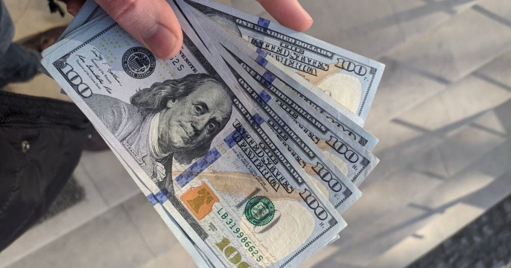 hand with $100 bills fanned out in hand save more money 2021 easy tips