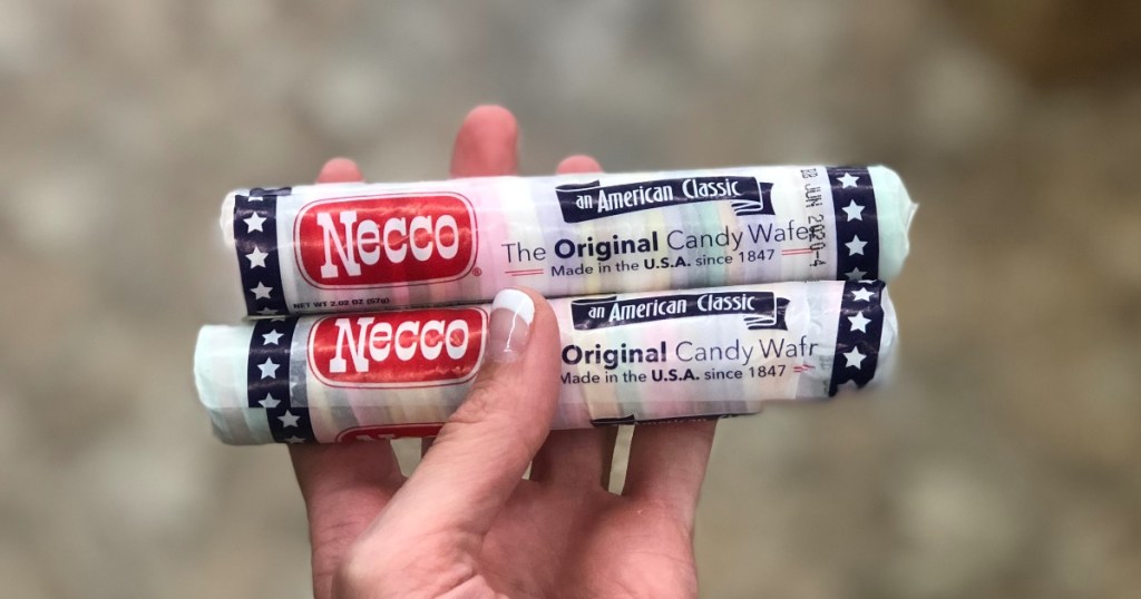 hand holding 2 packages of Necco wafers