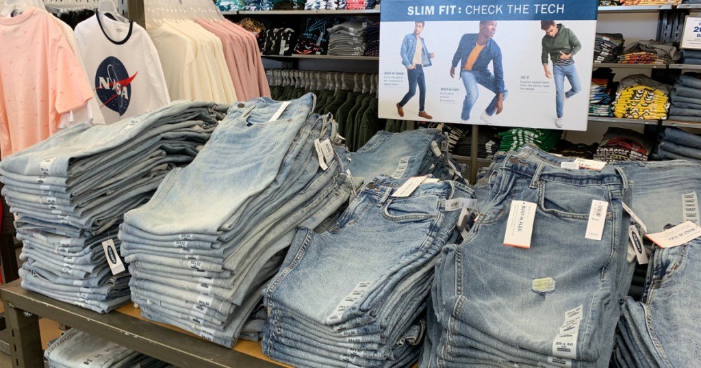 rows of jeans on table at Old Navy