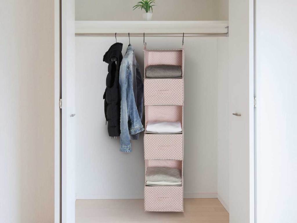 complete hanging bin holder with drawers inside a closet
