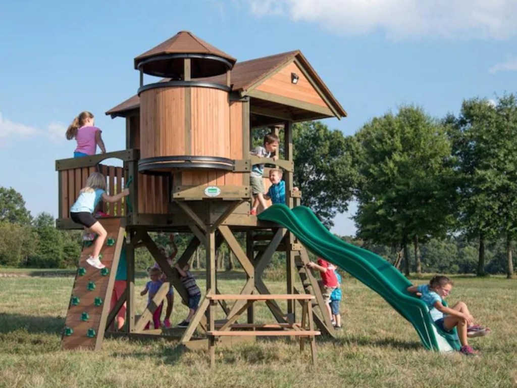 kids playing on elevated playhouse