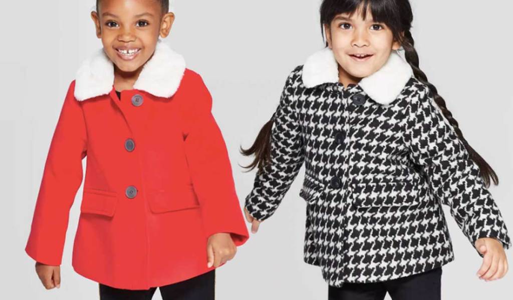little girls wearing adorable jackets one red and one black checkered