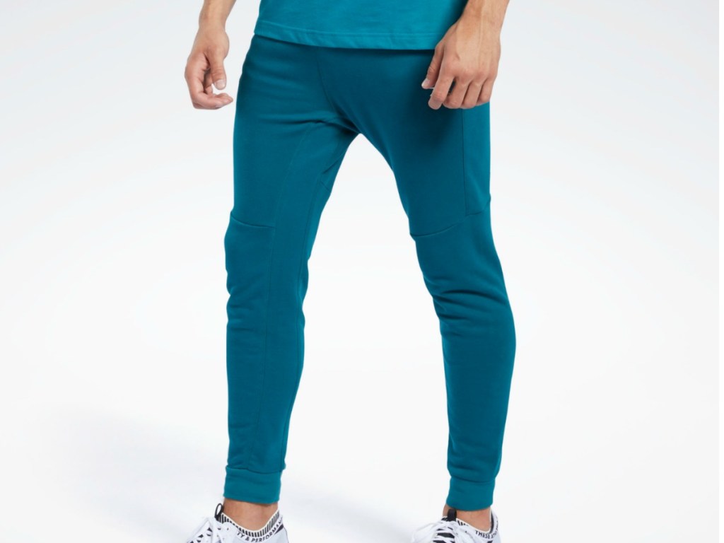 man wearing teal colored pants