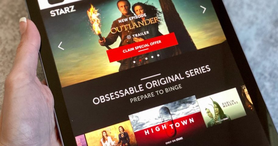 hand holding ipad with Starz app