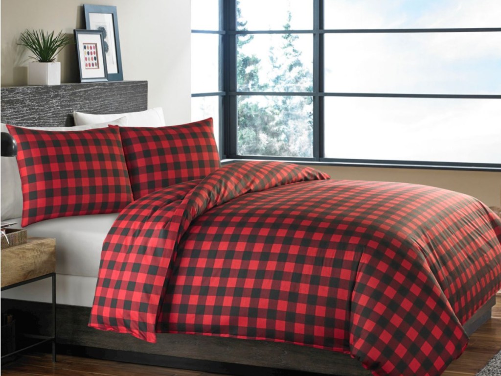 black and red plaid bedding set on bed in bedroom