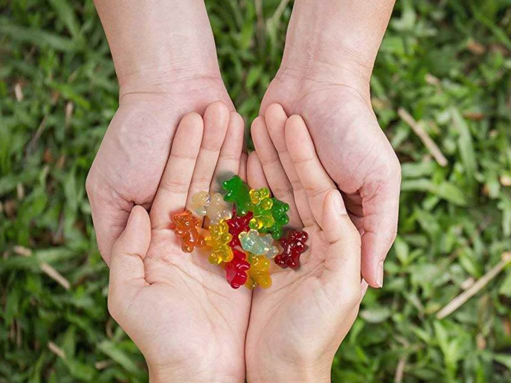 hands holding gummy bears