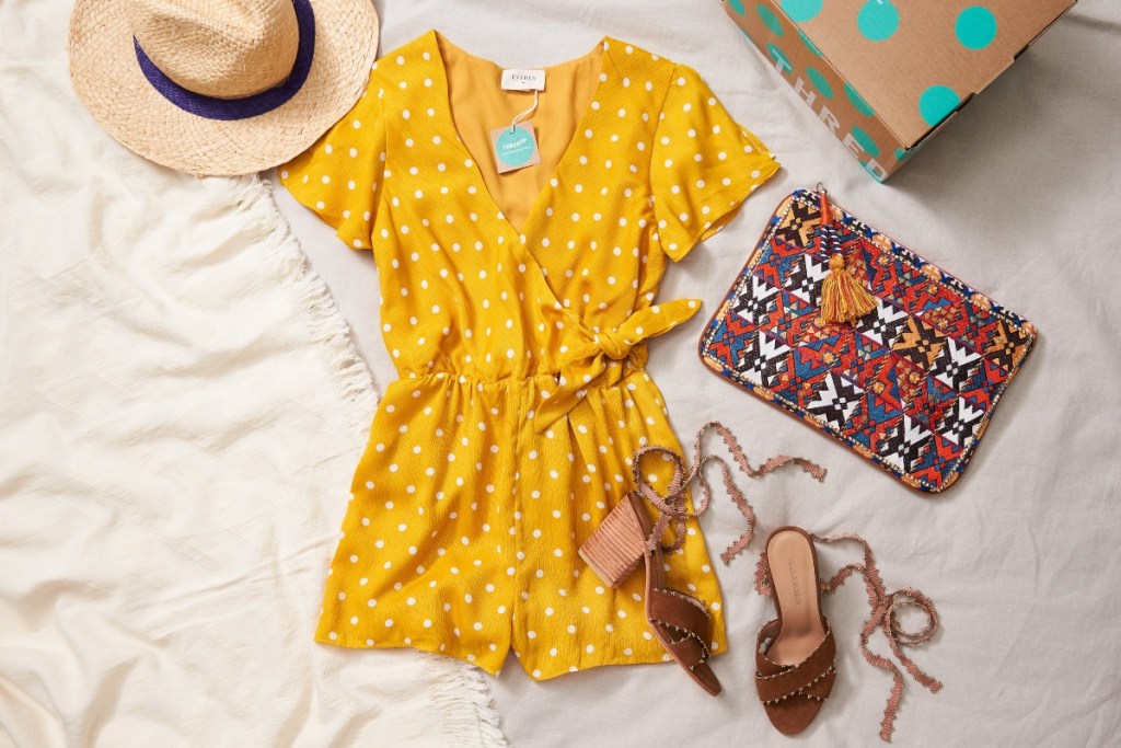 flat lay outfit with romper, shoes, hat, and bag