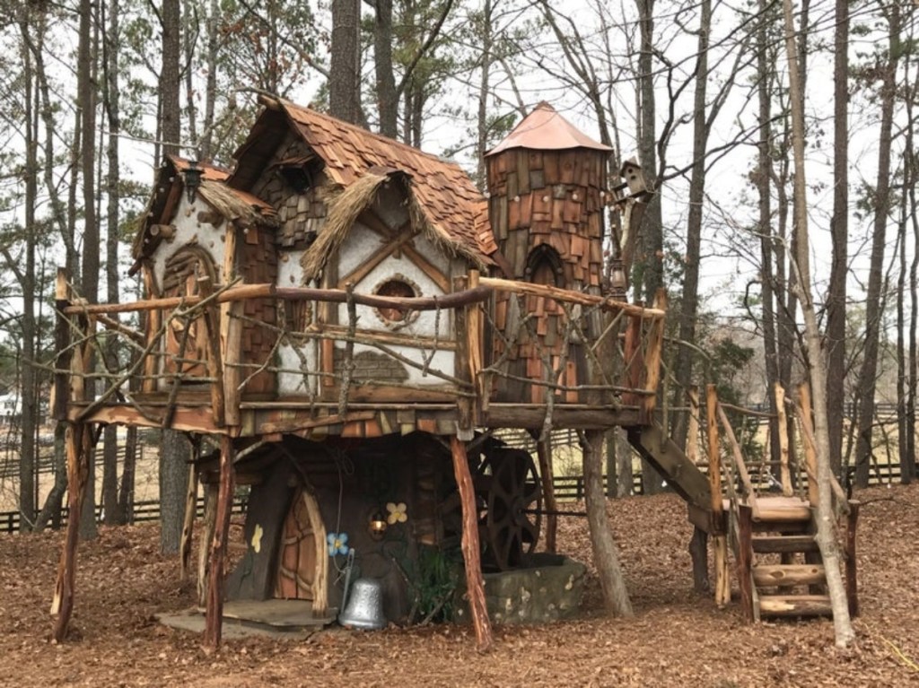 fairy tale tree house in wooded area