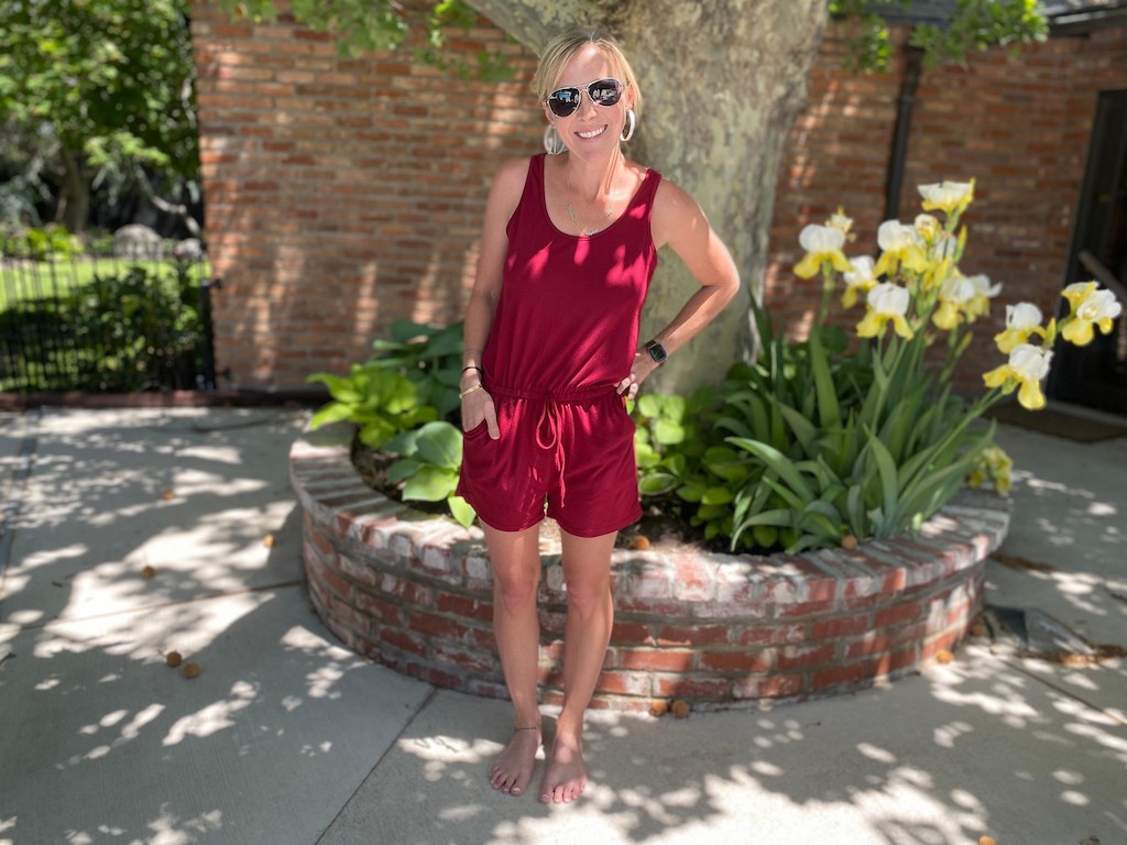 woman wearing red jumpsuit shorts