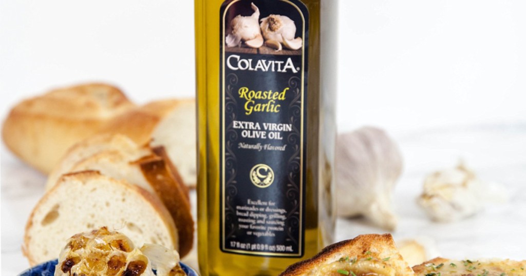 32oz Bottle of Colavita Roasted Garlic Olive Oil next to fresh bread
