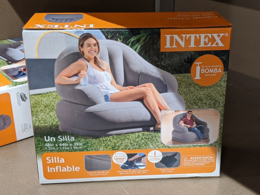 large grey inflatable camping chair in a box
