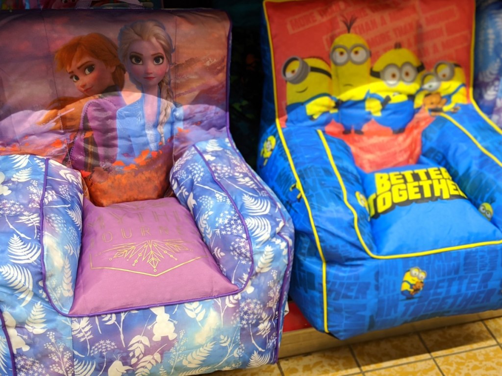 kids frozen and minion themed bean bag chairs sitting on store shelf