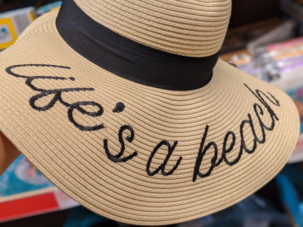 woman's life's a beach sun hat in-store at aldi