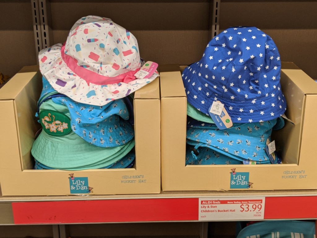 children's summer bucket hats stacked in a box at aldi 