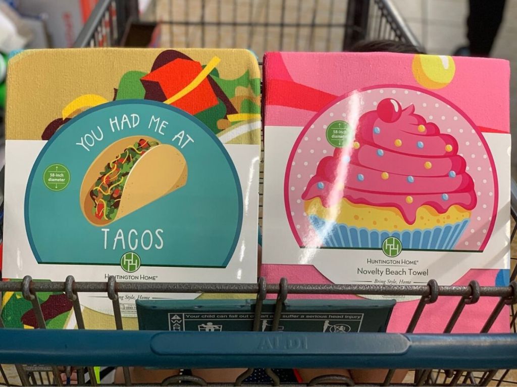 two novelty beach towels in the front of a shopping cart