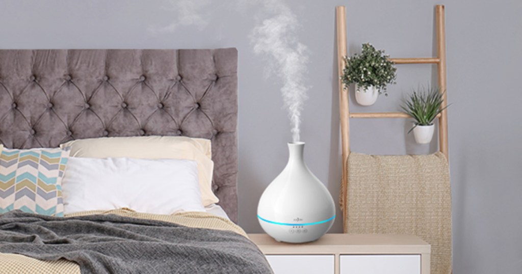 white Anjou diffuser on end table in bedroom