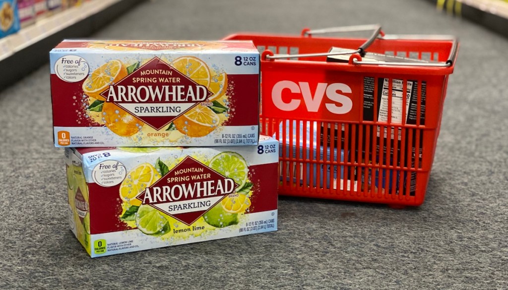 two cases of Arrowhead sparkling water next to CVS basket