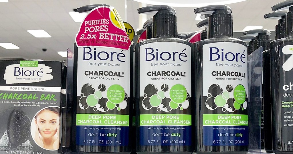 three black bottles of biore charcoal face wash on store shelf