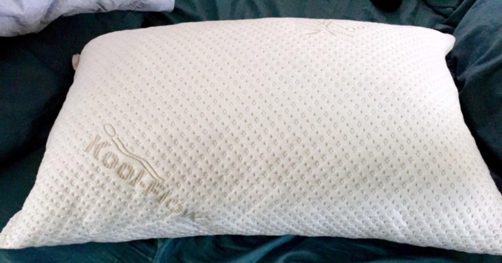 snuggle-pedic pillow on bed