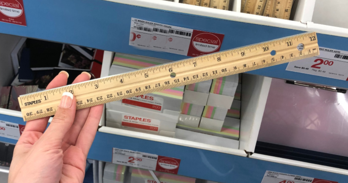 staples 12" wood ruler in hand at store