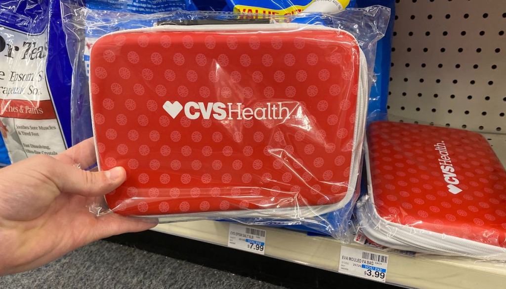 hand holding a CVS Health First Aid Kit