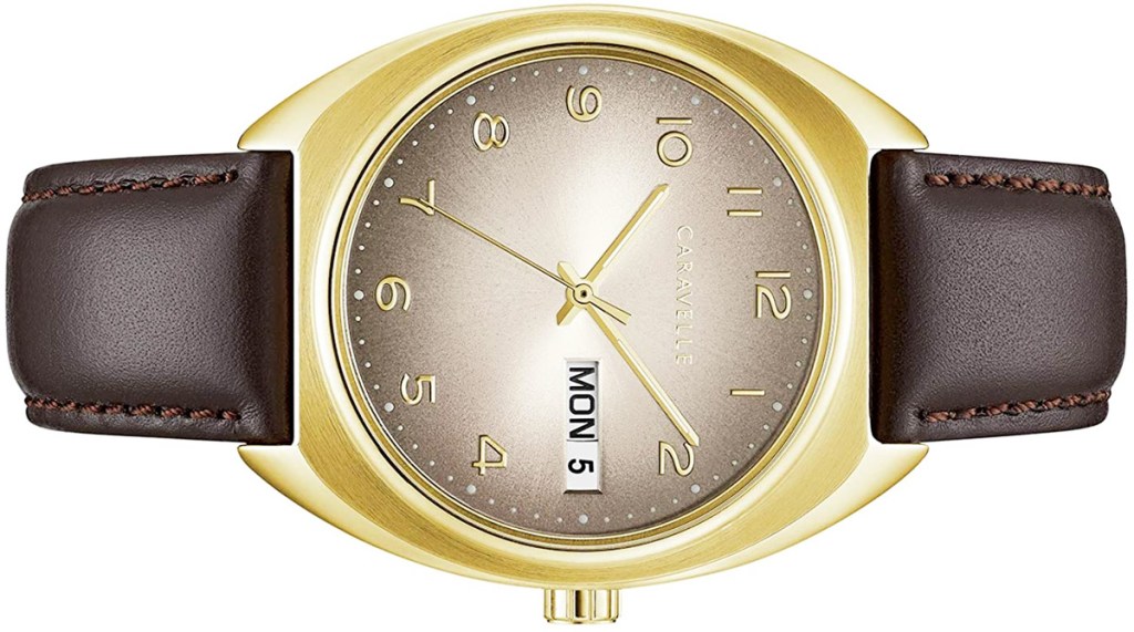 gold colored watch with brown leather strap and brown and white watch face