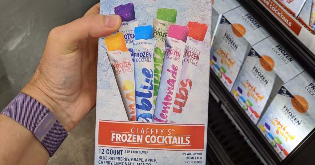 hand holding box of adult cocktails popsicles in store