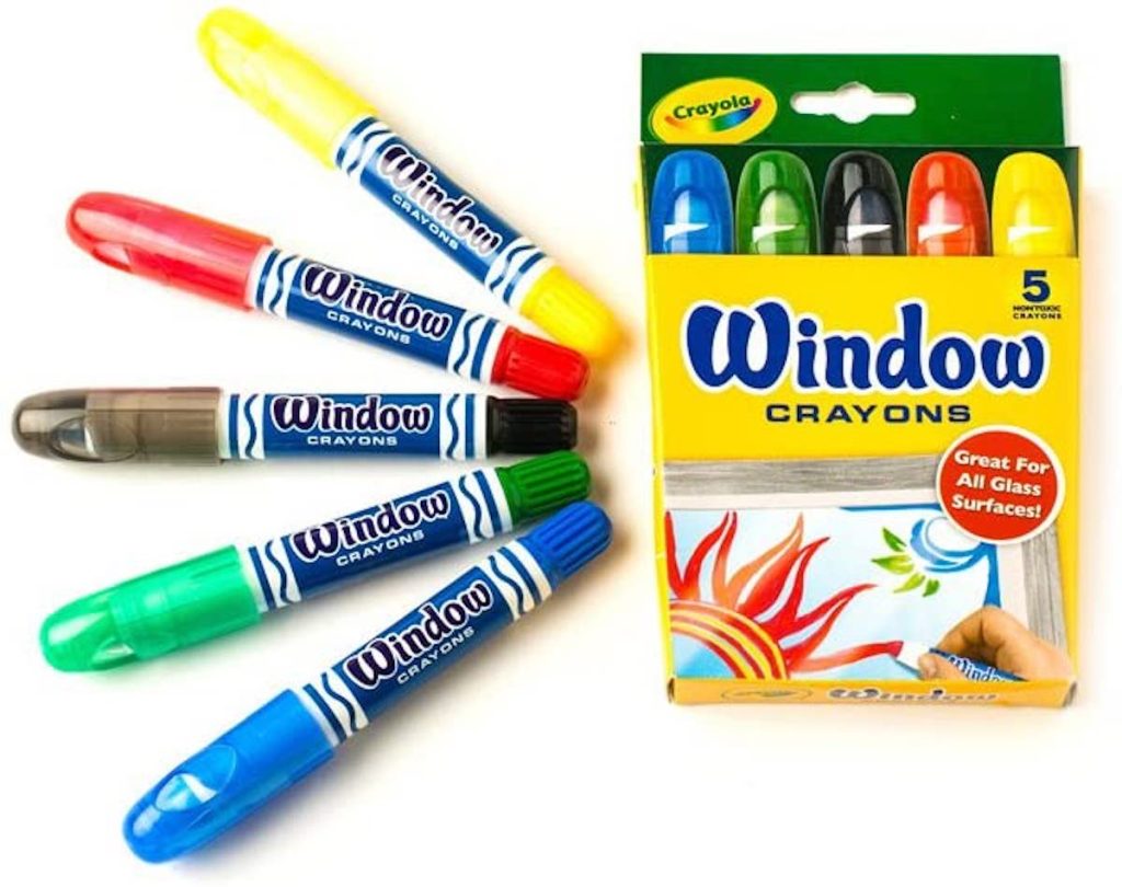 package of crayola window crayons with some spread out on white background