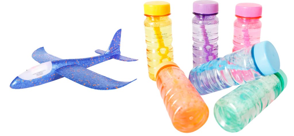 blue glider plane toy and six bottles of bubble solution in various colors