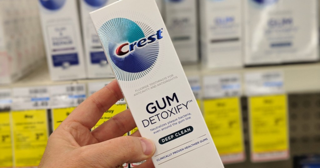 Crest Gum toothpaste in person's hand