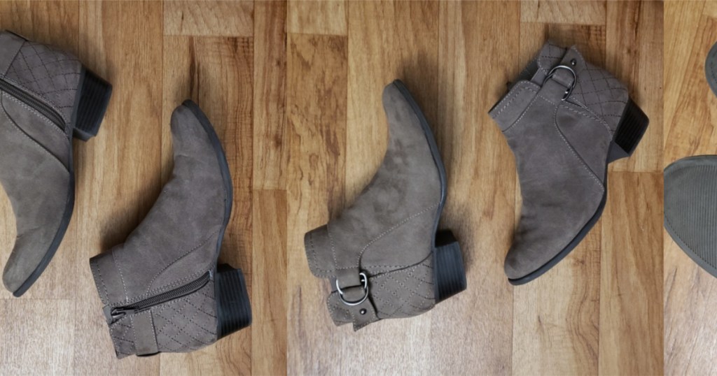 gray booties laying on wooden floor