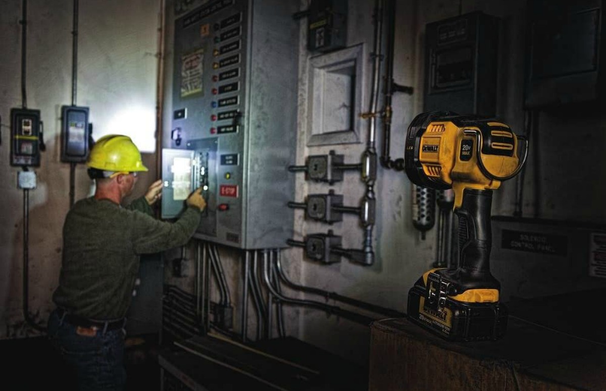 man checking fuse box