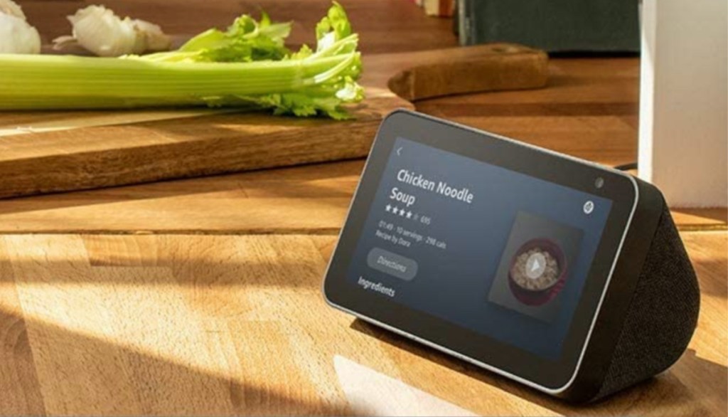 black smart device on kitchen counter showing recipe on screen
