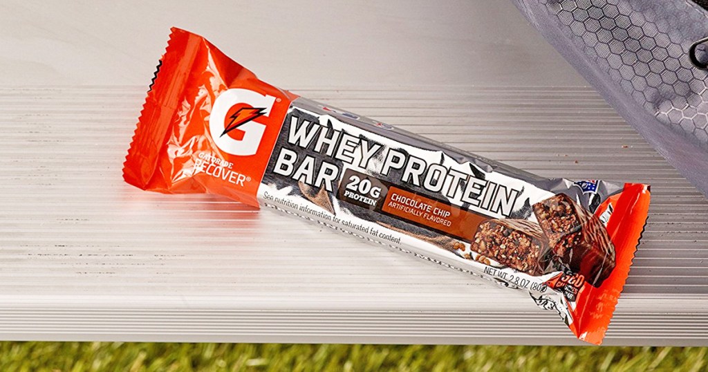orange and silver gatorade whey protein bar sitting on silver bench