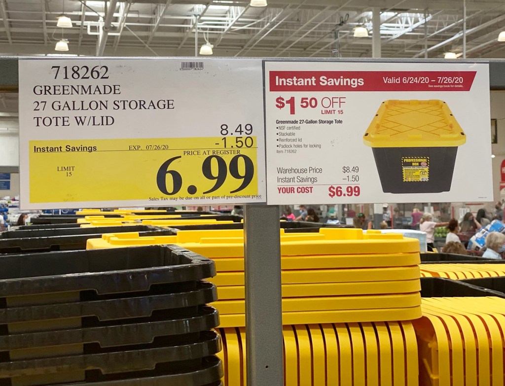 black and yellow plastic storage totes with $6.99 sale sign hanging above them