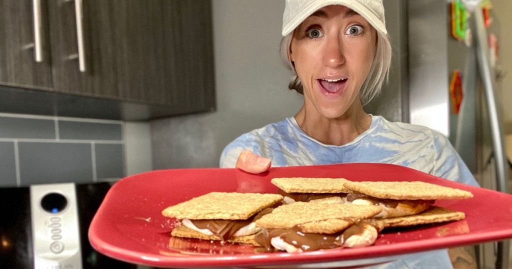 Woman holding a plate of air fryer S'mores